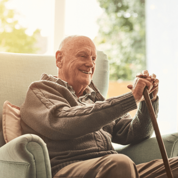 elderly man sitting in a chair
