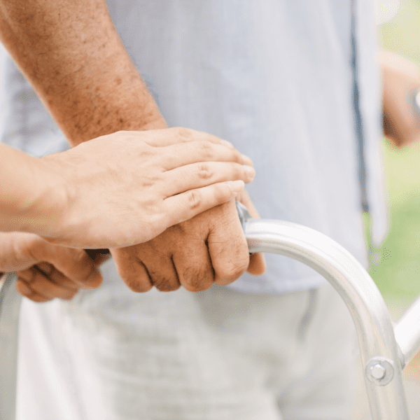 elderly person using a walker closeup